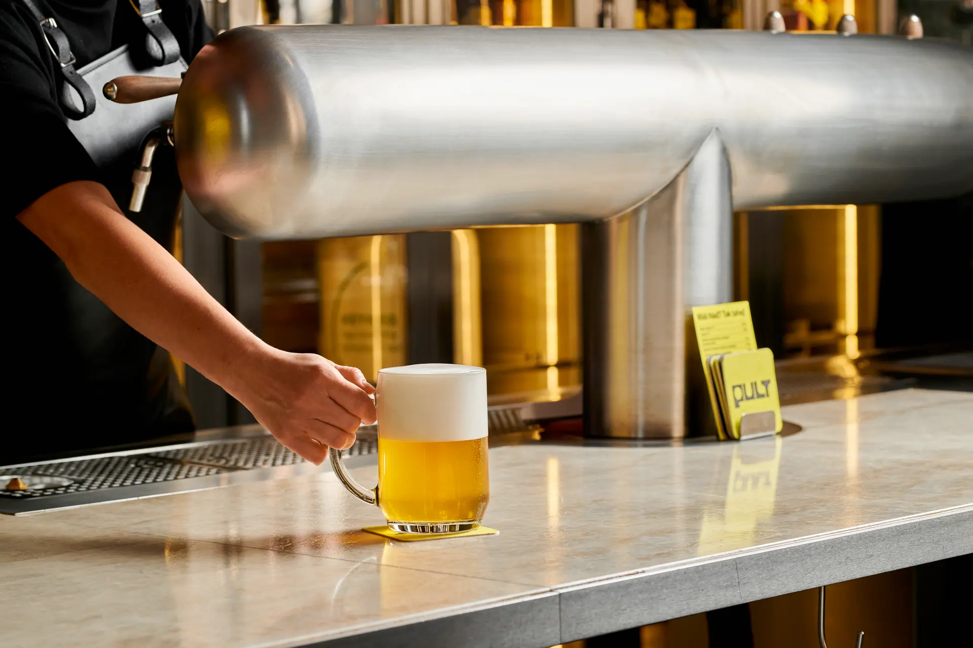 Freshly poured draft beer at the bar.